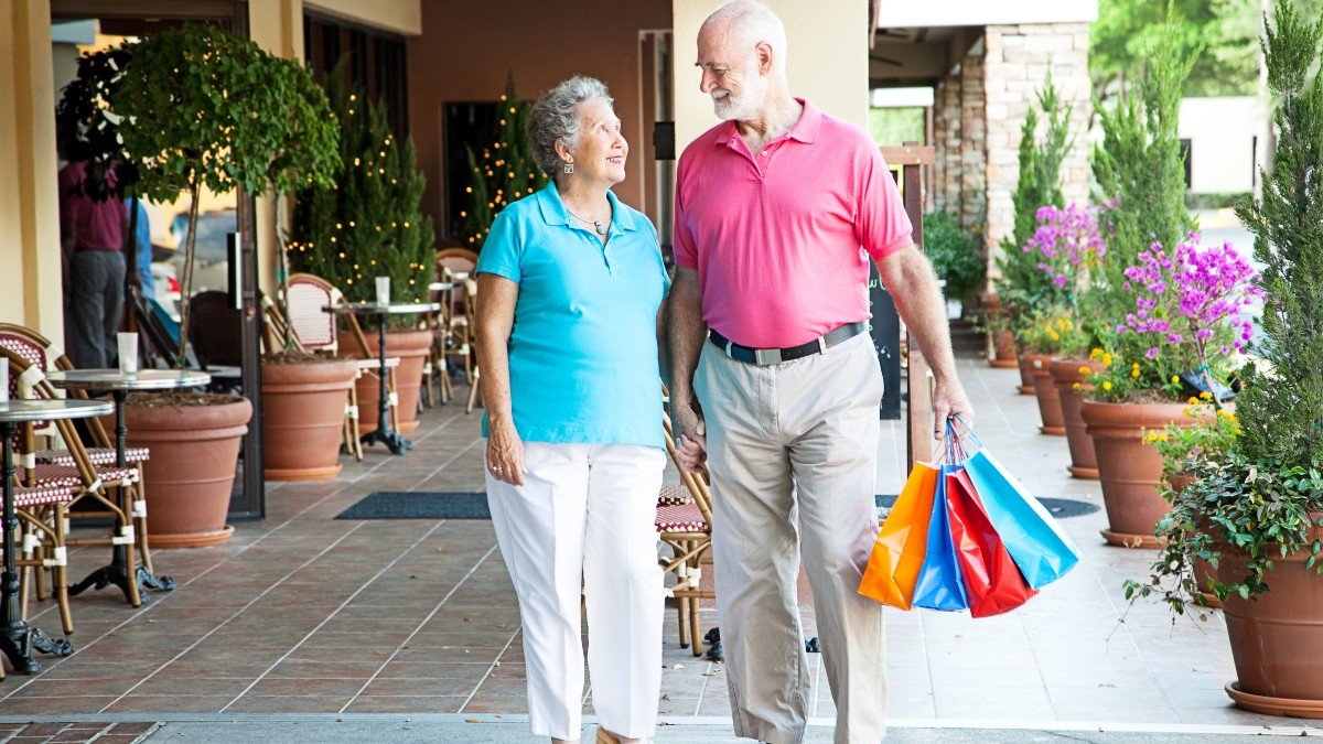 109839011 old couple walking shopping jpg