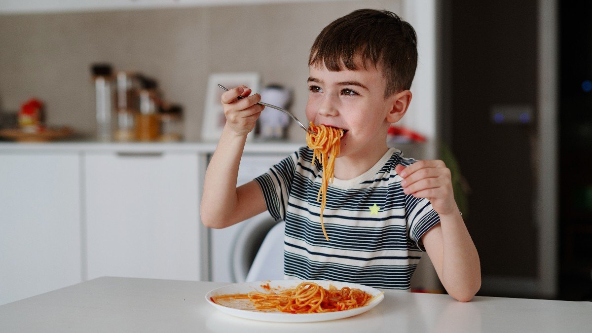 2615202619 child pasta food jpg