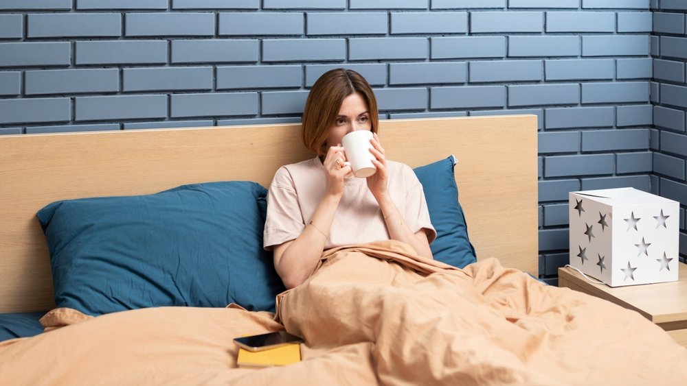 bed sleep drink coffee shutterstock 2259584587 jpg
