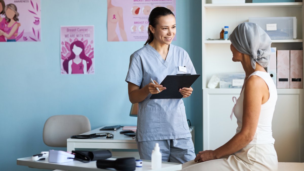 cancer patient with her doctor shutterstock 2688608295 jpg