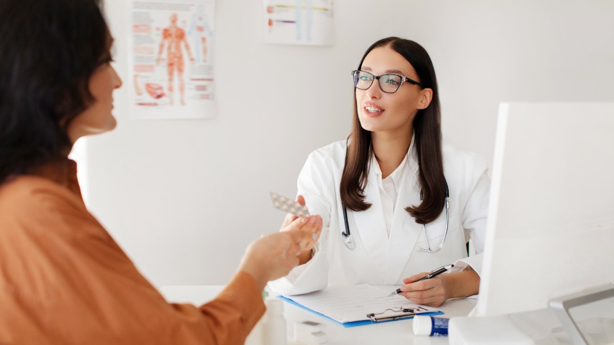 cheerful female doctor shutterstock 2639452615 jpg