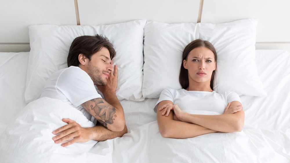 couple bed sleep shutterstock 2068616315 jpg