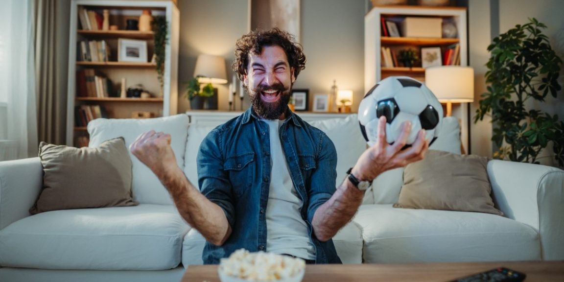2723228141 watching football game jpg