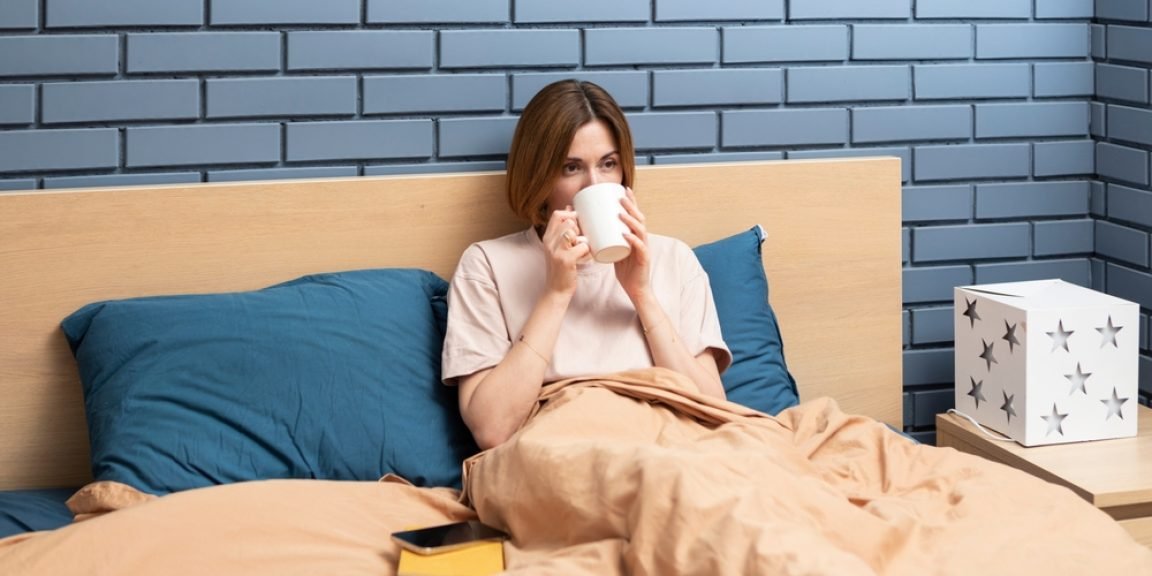 bed sleep drink coffee shutterstock 2259584587 jpg