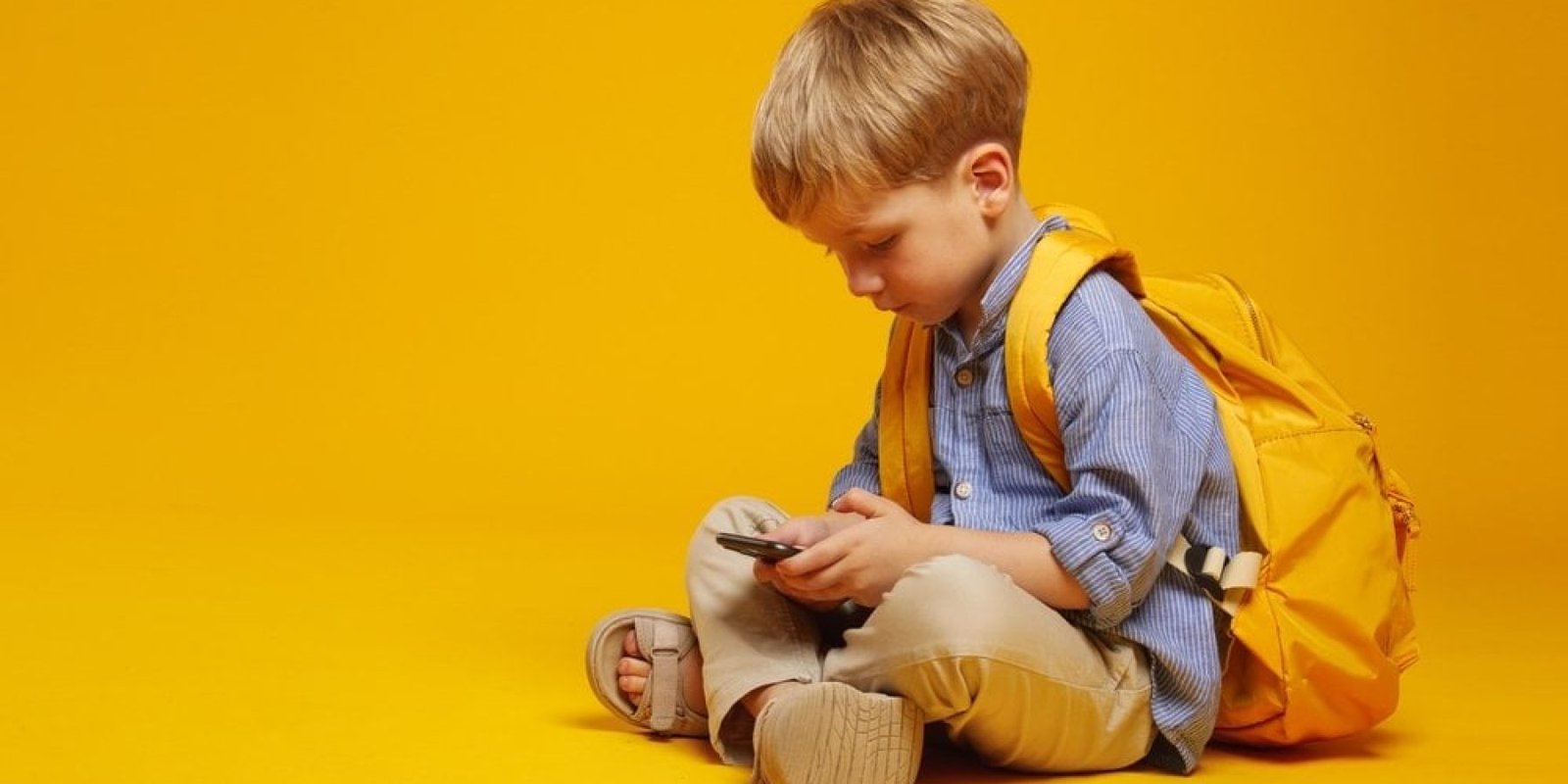 kid smartphone shutterstock 2464736895 jpg