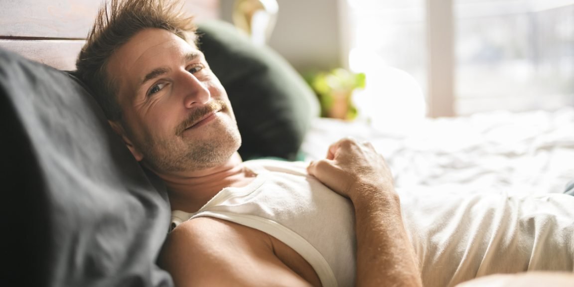 man bed iStock 2246677973 jpg
