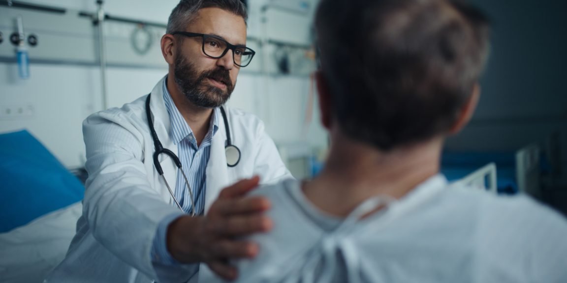 mature doctor with patient shutterstock 2231711111 jpg