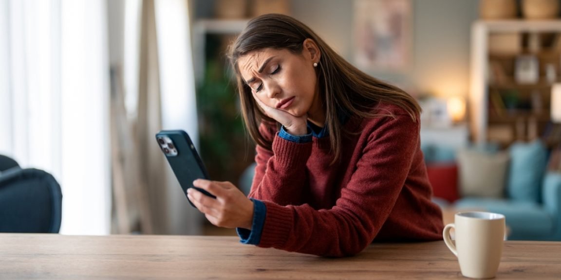 sad phone shutterstock 2382325621 jpg