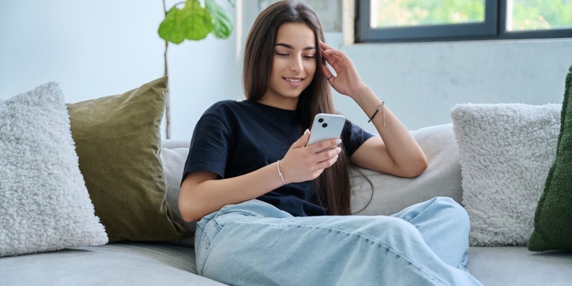 teen phone shutterstock 2696474823 jpg