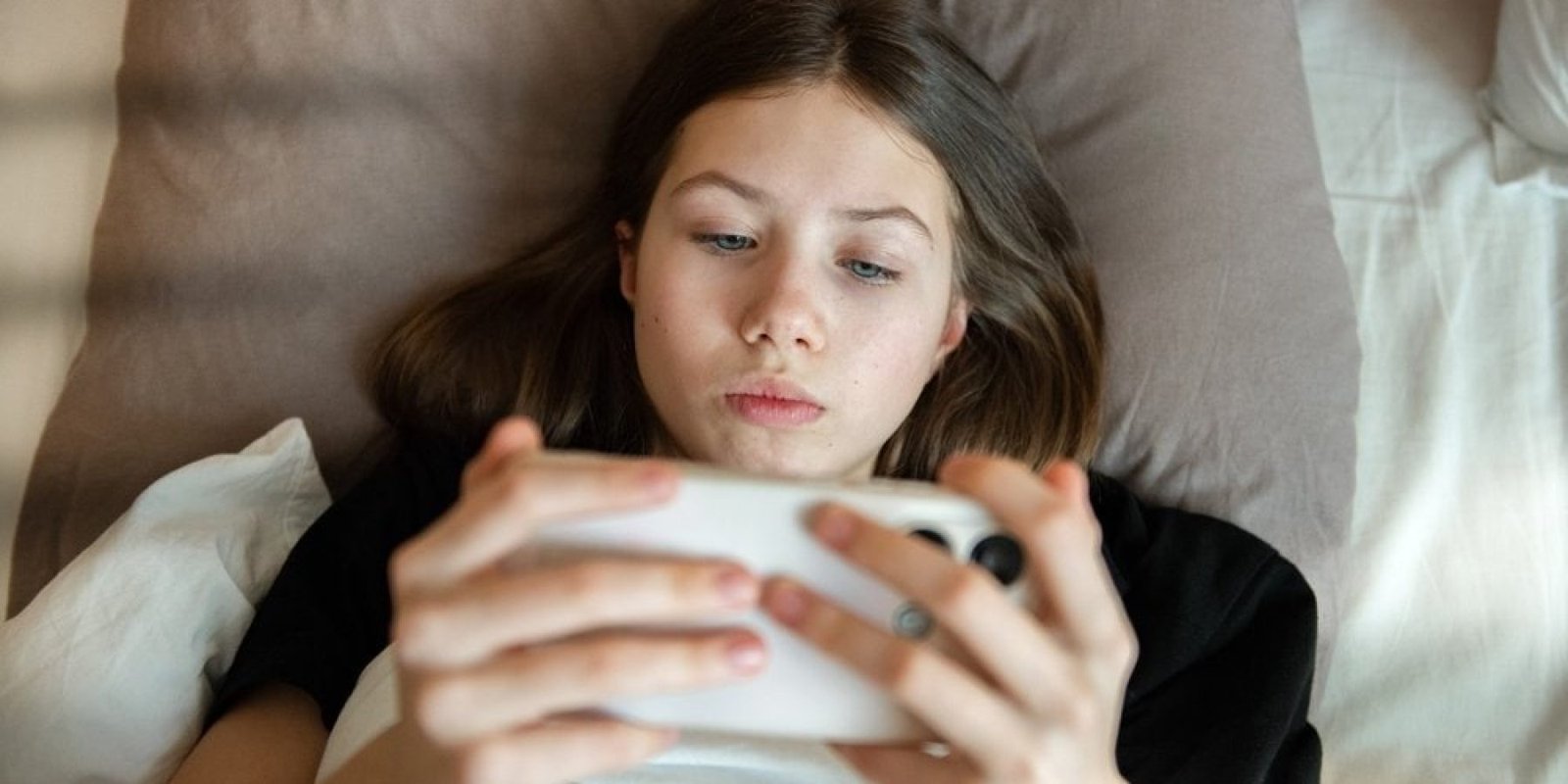 teen scroll phone shutterstock 2603098383 jpg