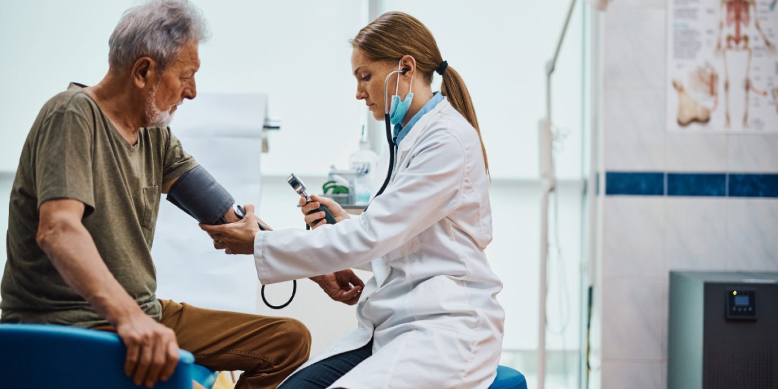 woman doctor examines patient shutterstock 2199688411 jpg