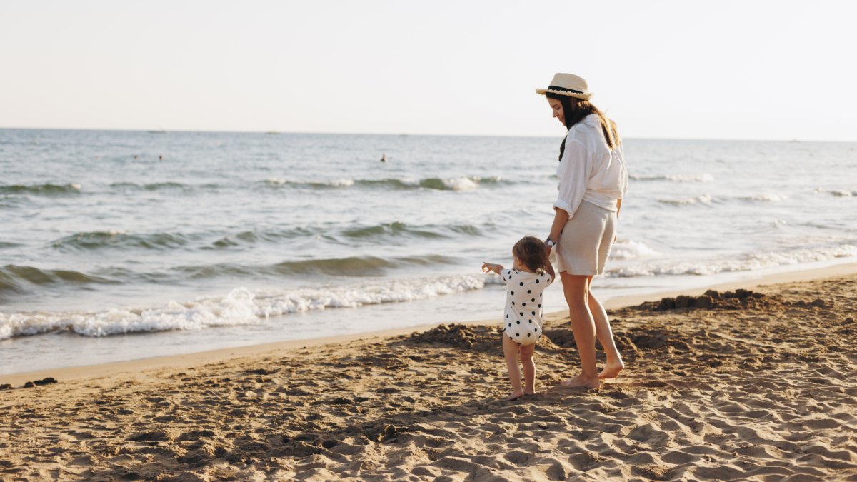 mother with baby summer vacation shutterstock 2739453199 jpg