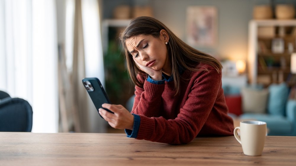 sad phone shutterstock 2382325621 jpg