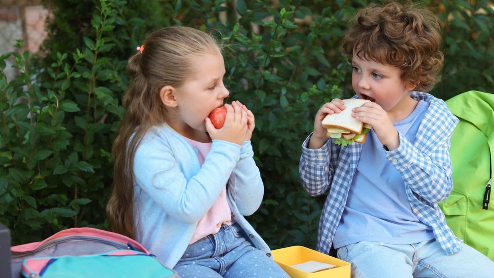 school eating shutterstock 2682231825 jpg