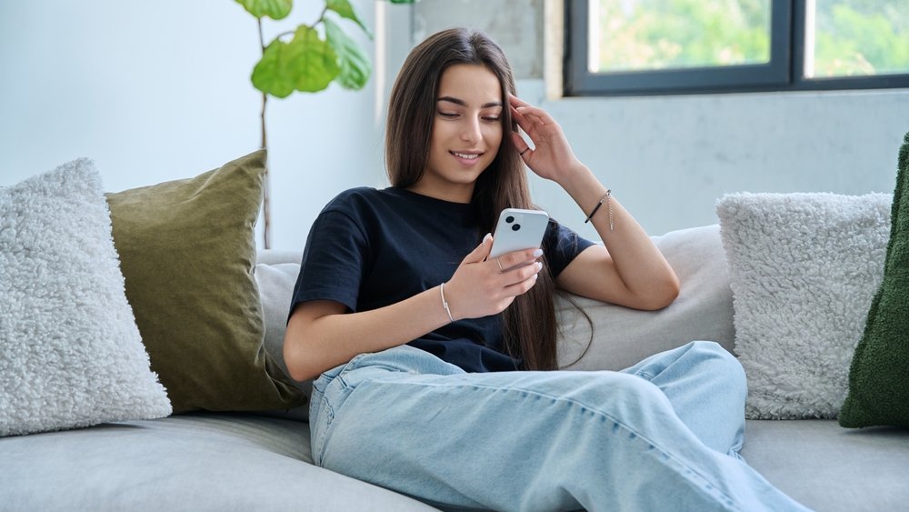 teen phone shutterstock 2696474823 jpg