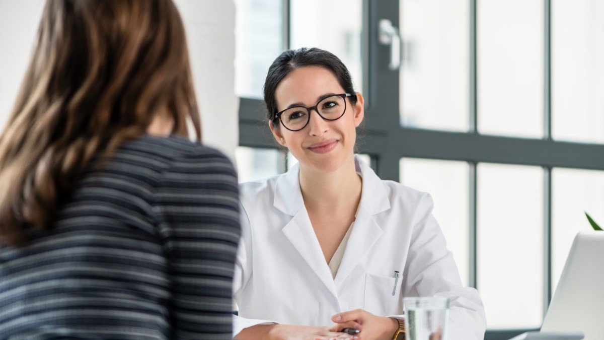 woman doctor with patient shutterstock 1035202660 jpg